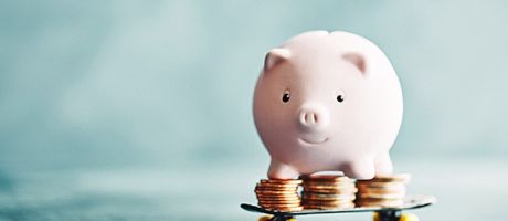 A piggy bank on a skateboard, illustrating funding imagination