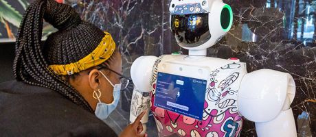 A woman interacts with robot in Johannesburg, South Africa. To illustrate that Africa has a crucial role in advancing the study of AI. 
