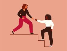 A woman reaches down to help a colleague up the stairs, illustrating allyship A woman reaches down to help a colleague up the stairs, illustrating allyship