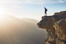 A man looks over the edge of a cliff, illustrating the drop-off in ERC funder in mid-career A man looks over the edge of a cliff, illustrating the drop-off in ERC funder in mid-career