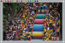 Malaysian Hindu devotees carry milk pots and kavadis as they climb steps to Sri Subramaniar Swamy Temple. To illustrate Malaysian universities climbing towards the top of the Impact Rankings 2025.