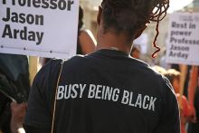An attendee, wearing a T-shirt stating “busy being black”, holds a placard during a vigil for former Cambridge professor Jason Arday in Trafalgar Square on 17 August 2026 in London, United Kingdom. An attendee, wearing a T-shirt stating “busy being black”, holds a placard during a vigil for former Cambridge professor Jason Arday in Trafalgar Square on 17 August 2026 in London, United Kingdom.