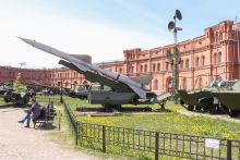 A Russian missile outside a grand building, illustrating the militarisation of universities