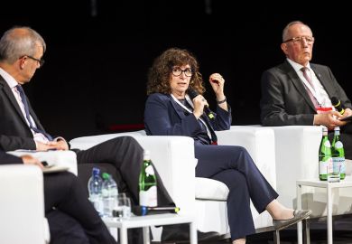 Luciana Vaccaro, president of the umbrella body Swissuniversities, sitting and speaking on a stage