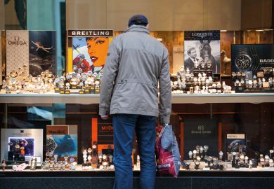 Window shopper looking at luxury watches Window shopper looking at luxury watches