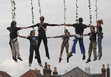 Aerial dancers holding hands, during a dress rehearsal ahead of their performance at the opening night of Salisbury International Arts Festival, England. To illustrate that institutions are increasingly grouping together locally in a bid to be heard. Aerial dancers holding hands, during a dress rehearsal ahead of their performance at the opening night of Salisbury International Arts Festival, England. To illustrate that institutions are increasingly grouping together locally in a bid to be heard.