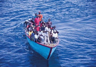 African people in overpacked boat