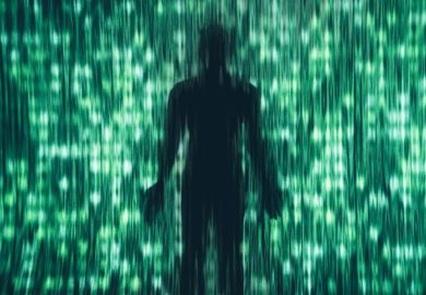 A dark human silhouette stands behind a curtain of vertical green light streaks and digital patterns