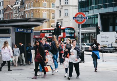 Aldgate East tube station People walking outside a busy Aldgate East tube station, London