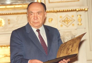 Alexander Yakovlev holding book
