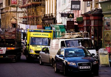 Ambulance in crowded street
