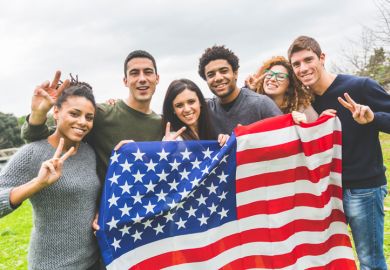 American students posing with USA stars and stripes flag