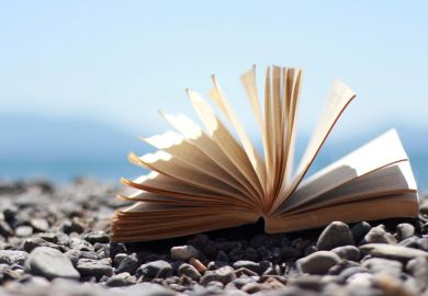 An open book on a beach