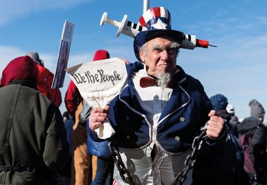 A demonstrator dressed as Uncle Sam stands for a photograph during an anti-vaccine mandate rally at the Washington Monument in Washington, D.C., U.S., on Sunday, Jan. 23, 2022. A demonstrator dressed as Uncle Sam stands for a photograph during an anti-vaccine mandate rally at the Washington Monument in Washington, D.C., U.S., on Sunday, Jan. 23, 2022.