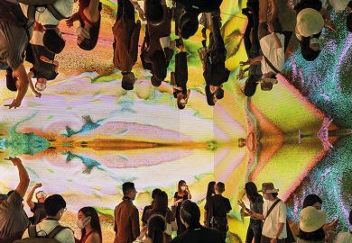 People visit immersive art installation “Machine Hallucinations Space: Metaverse by Refik Anadol at the Digital Art Fair Asia in Hong Kong, 2021