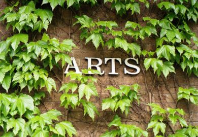 Arts Building sign covered in ivy