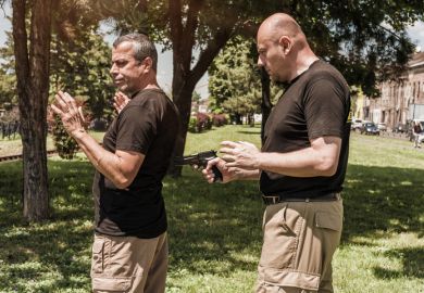 A man being held at gun point