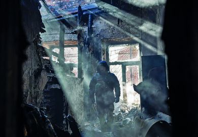 First responders in a damaged building in Kharkiv, Ukraine on March 15, 2022 First responders work in a building that was struck by a rocket attack in Kharkiv, Ukraine on March 15, 2022