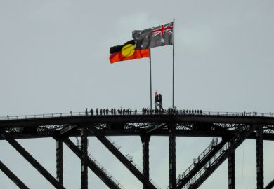 The Australian and Australian Aboriginal flags fly on the Sydney Harbour Bridge