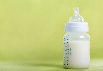 A baby bottle full of milk