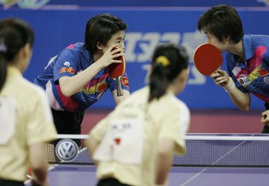 Chinese table tennis players whisper to each other