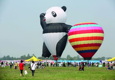 A panda-shaped hot-air balloon is displayed during the Zhengzhou Airshow jpg A panda-shaped hot-air balloon is displayed during the Zhengzhou Airshow to illustrate China’s tuition fee hikes ‘foreshadow’ marketised HE system