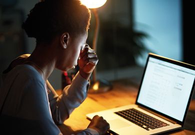 Black woman working on laptop