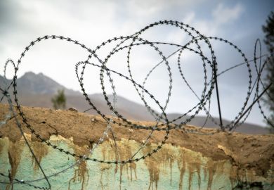 Barbed wire on the wall in Ishkashim, Afghanistan