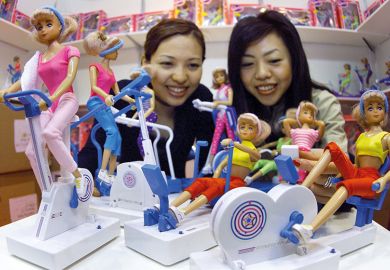 Dolls on exercise bikes