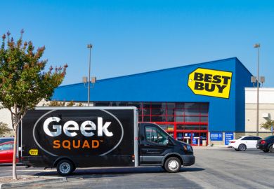 A large Geek Squad van is parked at the Best Buy retail store located in Montclair, California.