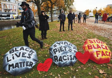 Human rights activists attend a rally against blackface characters during the Saint Nicholas parade in The Hague, Netherlands, 2019