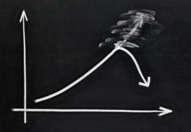 A graph on a blackboard turns downwards A graph on a blackboard turns downwards