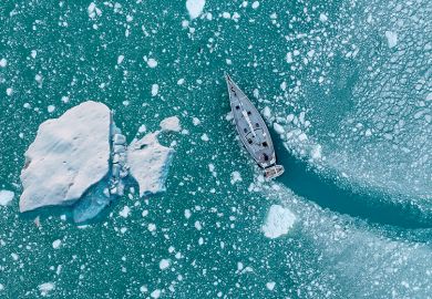 Boat changing course to avoid iceberg, illustrating scientific course correction. Boat changing course to avoid iceberg, illustrating scientific course correction.