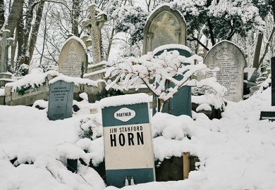 The gravestone of Jim Stanford Horn shaped like a book by Penguin Books publishing house is covered in snow at Highgate Cemetery on 12 December, 2022 in London, England. To illustrate that reading is dying out on UK campuses.