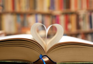 A book with its pages folded into a heart shape, symbolising publc support for universities
