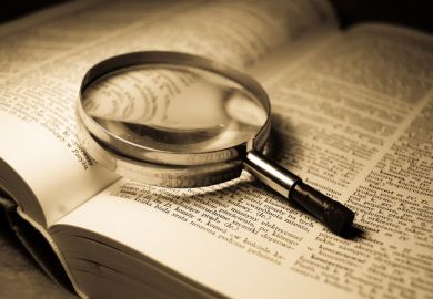 A magnifying glass on a book