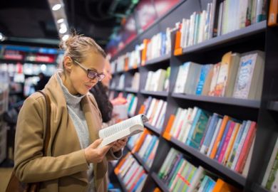 woman reading in a bookshop woman reading in a bookshop