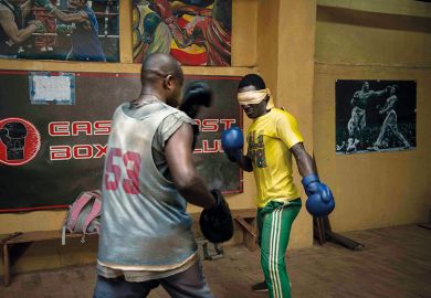 Boxers spar in gym, one of them blindfolded Boxers spar in gym, one of them blindfolded