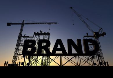 A giant sign reading "Brand" on scaffolding