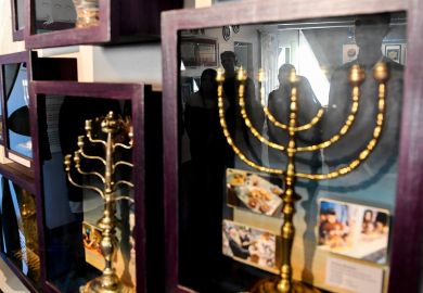 Students from the Denver Center for International Studies learn about menorahs from museum educator Joan Wallis at the Mizel Museum in 2017.