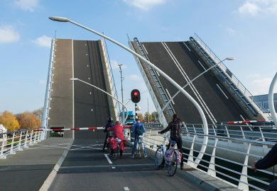 cyclists on bridge