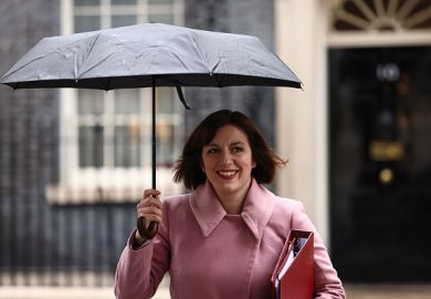 Bridget Phillipson holds an umbrella