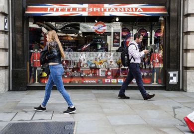 People walking past Little Britannia shop, London