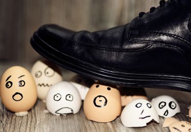 Broken eggs under man’s shoe Broken eggs under man’s shoe