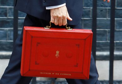 Chancellor carrying the budget briefcase in Downing Street. To illustrate that Healey is predicted to support ‘pro-growth research’ in his first Budget.