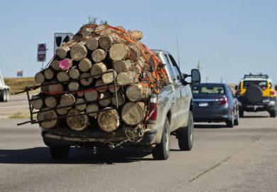 truck carrying logs illustrating burden of REF