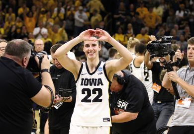 Caitlin Clark #22 of the Iowa Hawkeyes gestures to the crowd as she leaves the court after the game against the West Virginia Mountaineers during their second round match-up in the 2024 NCAA Division 1 Women's Basketball Championship