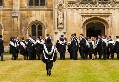 Cambridge University students in gowns on graduation day at Corpus Christi College, England