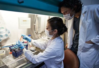 Canadian scientists at work in laboratory Canadian scientists at work in laboratory