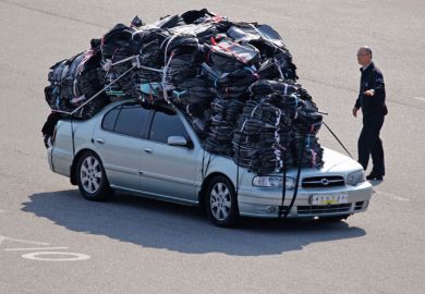 Car covered in heavy baggage Car covered in heavy baggage